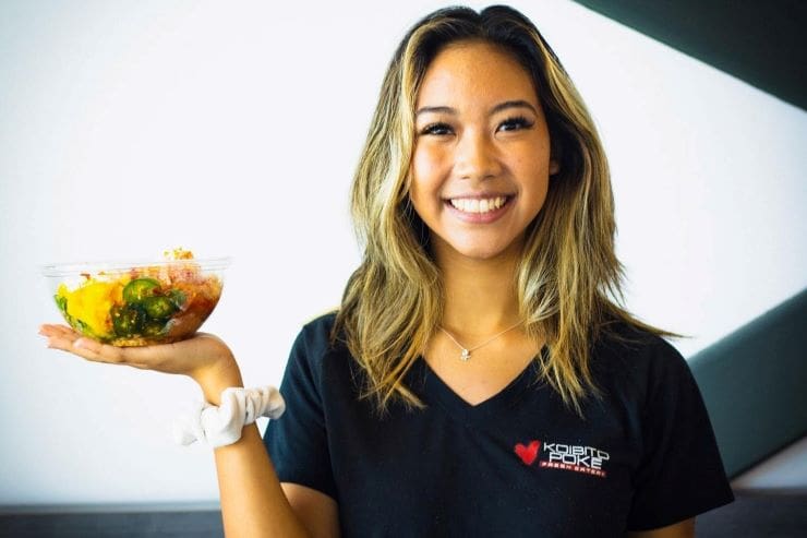 Koibito Poke Gainey Village employee with bowl